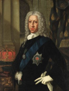 Portrait of the Old Pretender (1688-1766), half-length, in a blue coat and white jabot, wearing the Order of the Garter, beside a carved pillar on which his crown rests, in an interior