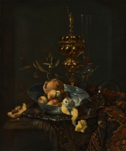 A gilt cup and cover, a roemer, a façon-de-venise glass, peaches, oranges and a peeled lemon in a porcelain bowl on a partially draped table