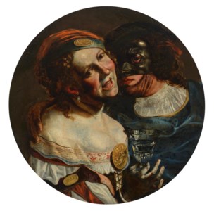 A young couple in masquerade costume