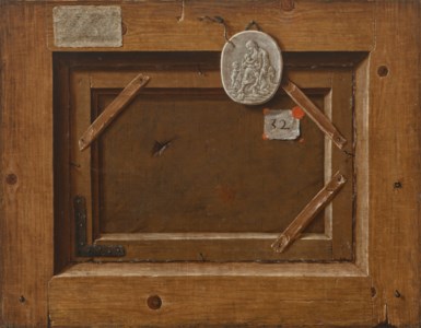 A trompe l'oeil of the back of a painting with a plaster medallion of Charity, an extensively inscribed label, an inventory number with red wax, and a spider