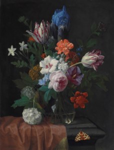 Hibiscus, parrot tulips, carnations, a rose, an iris, snowballs and other flowers in a vase on a partially draped stone ledge, with a garden tiger moth