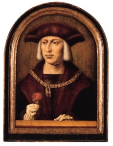 Portrait of Emperor Maximilian I von Habsburg (1459-1519), small half length, wearing a fur-lined black mantle with fur hat and gloves, the badge of the order of the Golden Fleece, holding a carnation in his right hand