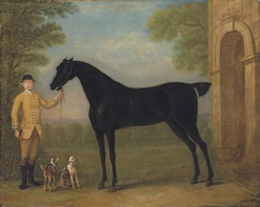 A dark bay racehorse held by a jockey, with a couple of hounds, by an archway, in a landscape