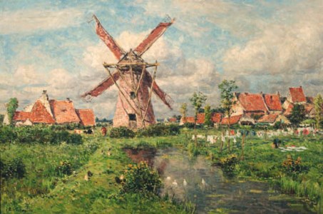 A windmill in a village in summer