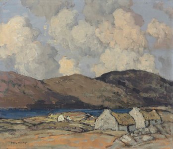 Thatched cottages with mountains beyond