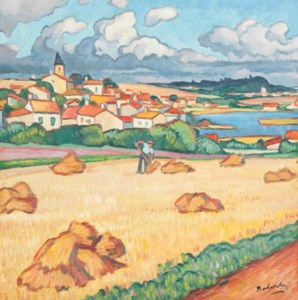Worker in a field with a town in the background