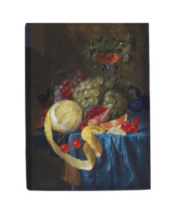 A partly-peeled lemon, fig, slice of orange, cherries, plums and bunches of grapes with a façon de Venise wine glass on a draped stone ledge