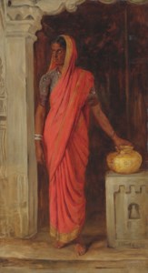 An Indian woman wearing a red sari