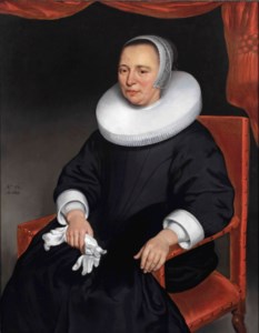 Portrait of a lady, three-quarter-length, in a black dress and ruff, holding a pair of gloves in her right hand, before a draped curtain