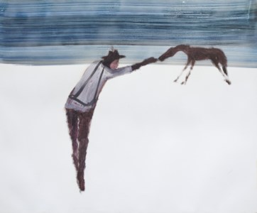 A Man feeding a horse