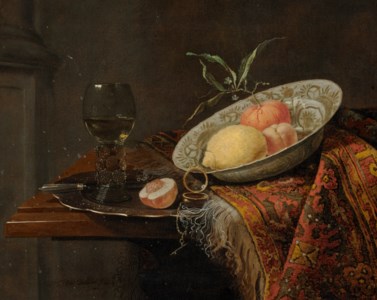 A lemon, orange and nectarine in a porcelain bowl, on a rug, and a roemer on a pewter platter, on a table