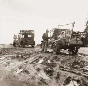 One migrant family hauls the broken-down car of the other to the fields at Nipomo, 1936