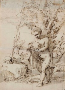A young boy holding a skull in a wooded landscape