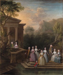Group portrait of a family, by a lake and a classical pavillion