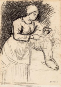 A woman shearing a sheep