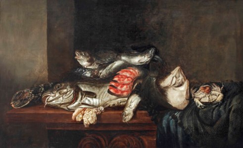 A lobster, cod, flatfish, salmon, crab, mussels and other fish in a wicker basket with a fish net on a partially draped table