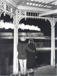 Mr. and Mrs. Pope watch the last steam powered passenger train, Max Meadows, Virginia, 1957
