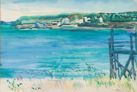 Ocean inlet with houses in the distance