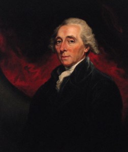 Portrait of Richard Paul Jodrell (1761-1831), half-length, in a black coat, against a red curtain