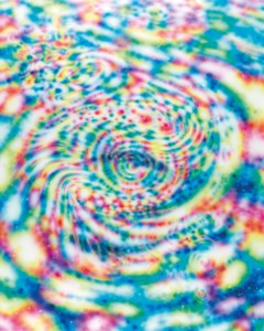 Carp Swimming In Rainbow