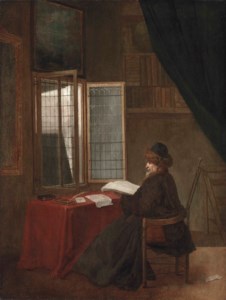 An old man seated at his desk before an open window, holding a book