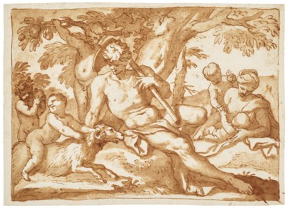 A young family relaxing by a tree