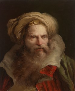 A bearded man wearing a turban