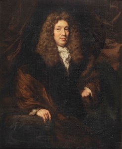 Portrait of a gentleman, three-quarter-length, in a black and brown coat, standing next to a stone ledge