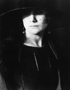 PORTRAIT OF A WOMAN IN WIDE-BRIMMED HAT AND FURS, 1923