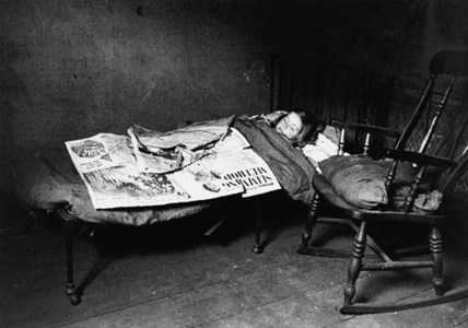 'CHILD IN BED, LIVERPOOL SLUMS', 1955, PRINTED LATER