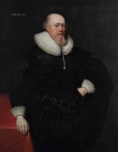 Portrait of a gentleman, probably Sir Théodore Turquet de Mayerne (1573-1654), three-quarter-length, in a black coat with a lace ruff and cuffs, standing beside a table