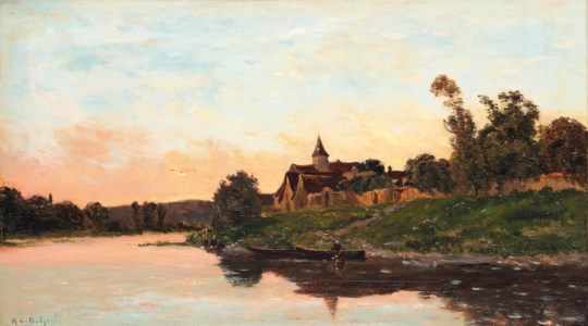 A fisherman on a river at the end of the day