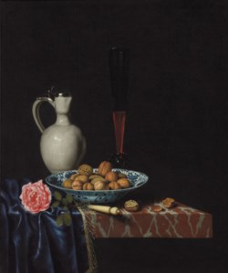 A wan-li bowl with walnuts, a façon de venise wine glass, an ivory-handled knife, a Delft stoneware jug and a rose on a partially draped marble ledge