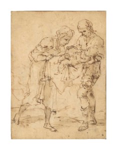 A woman looking at an infant held by a man