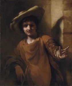 A young boy holding a flute