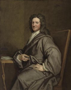 PORTRAIT OF SIR NICHOLAS PELHAM (C.1650-1739), SEATED, THREE-QUARTER-LENGTH, IN A GREY ROBE, BY A DRAPED TABLE WITH A LETTER