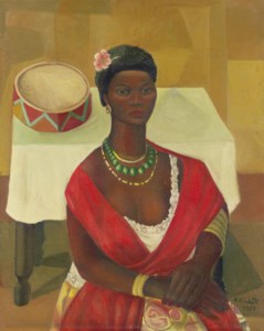 Mulata sentada na frente da mesa com pandeiro