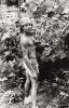 Untitled (man urinating in bush)