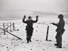 A US soldier with a German prisoner of war during the Battle of the Bulge. Near Bastogne. Belgium