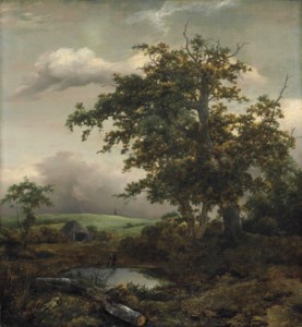 A wooded landscape with a man at rest by a pond near a hut, a windmill beyond