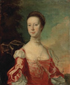 Portrait of a lady, possibly Elizabeth Pigot (c. 1726-1766), half-length, in a pink dress, with pearls and a shawl, in a wooded landscape