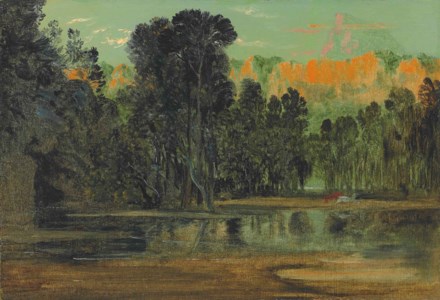 A wooded landscape at sunset