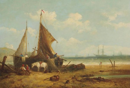 Fishing boats beached on the coast with fishermen sorting the catch