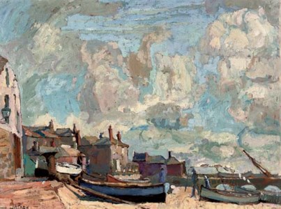 Fishing boats beached before a Cornish village