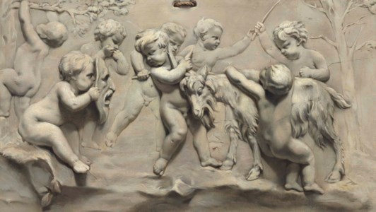 A trompe l’oeil bas-relief of putti playing with a goat