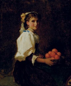Seated girl holding oranges