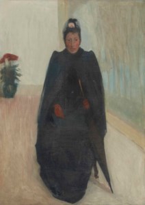 Femme assise avec un parapluie