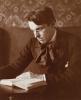 William Butler Yeats reading a book