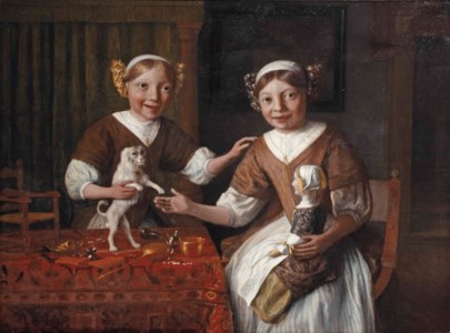 Portrait of two young girls with a pet dog and a doll, seated at a draped table with toys and a chair for the doll