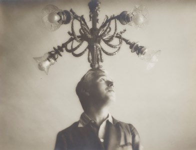 Charlie Chaplin with Chandelier, Paris, France, 1931